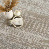 Close-up of the Tupsan Washable Area Rug. Cream, beige, and gray geometric pattern. Modern farmhouse style. Styleshot