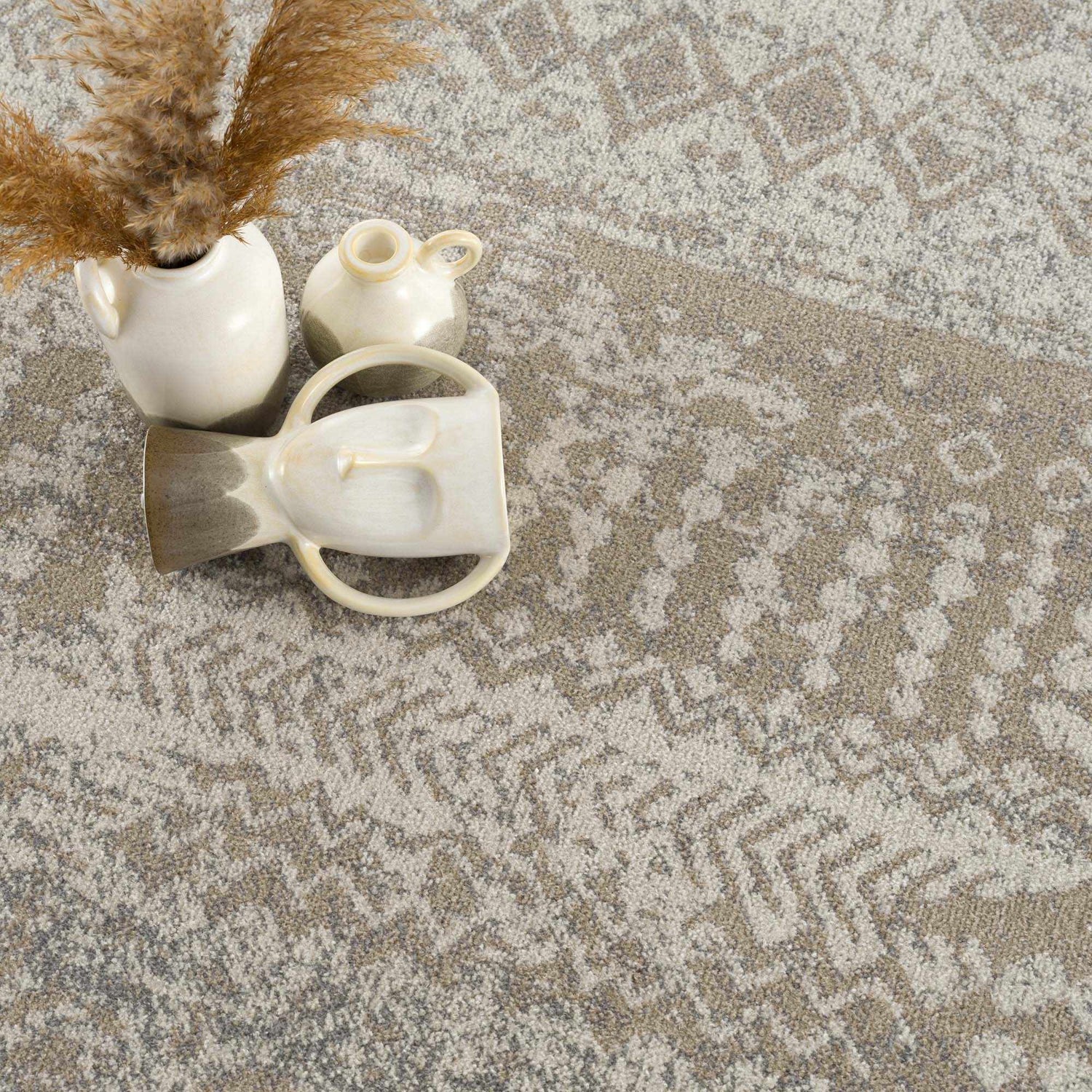 Close-up of the Tupsan Washable Area Rug. Cream, beige, and gray geometric pattern. Modern farmhouse style. Styleshot