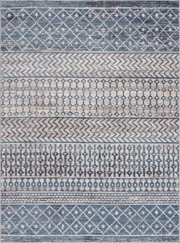 Close-up of the Southglenn Washable Area Rug. Features a blue, gray, and beige contemporary geometric pattern. Design-Rectangle-537