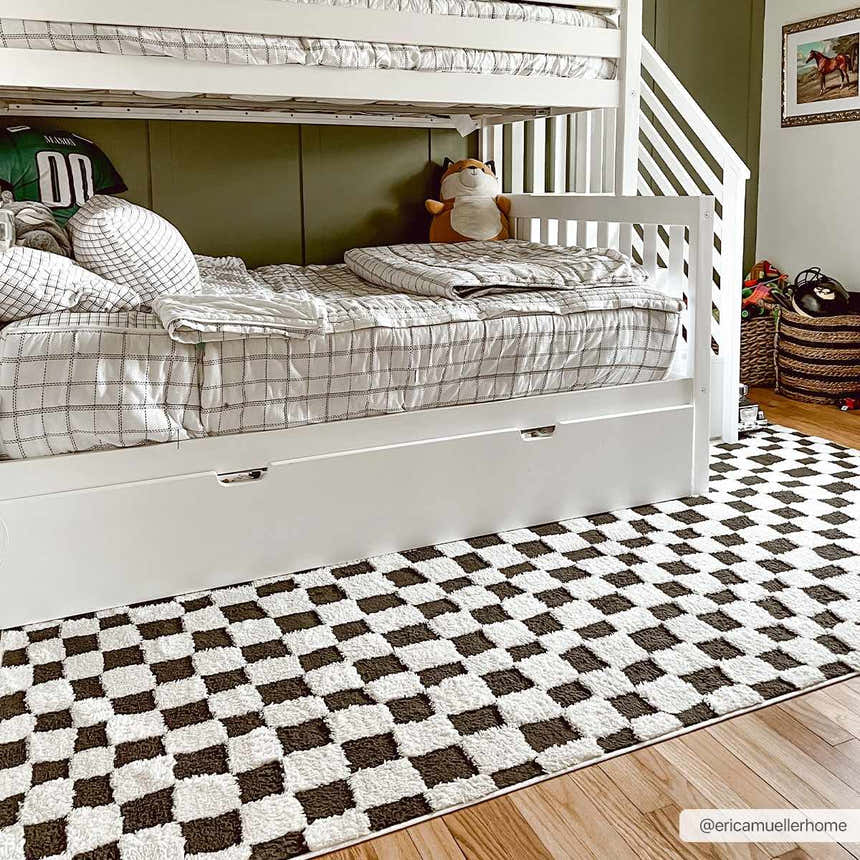 Kids bedroom with white bunk beds and Lajos Black & White Checkered Plush Rug on wood floor. Roomscene-Runner