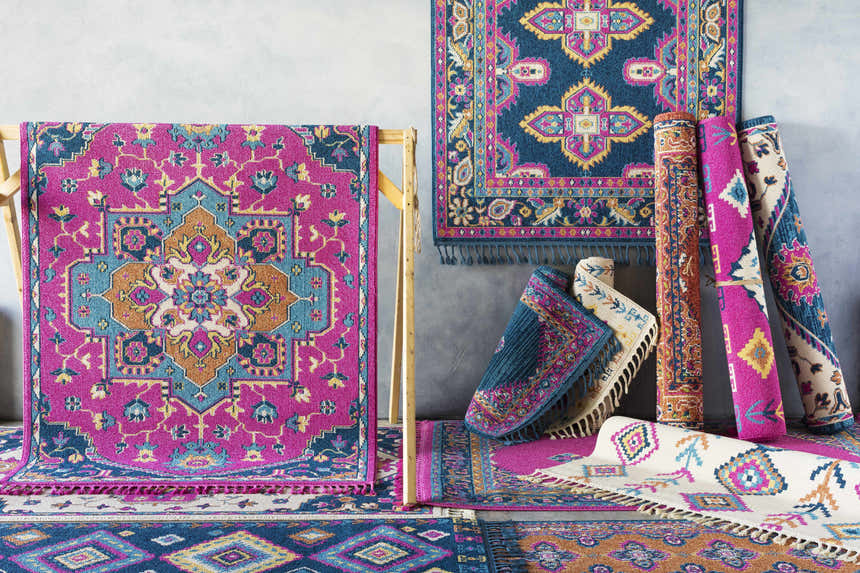 Franktown Magenta Carpet display. Bohemian style rugs in aqua, blue, fuchsia, ivory, and orange colors. Styleshot