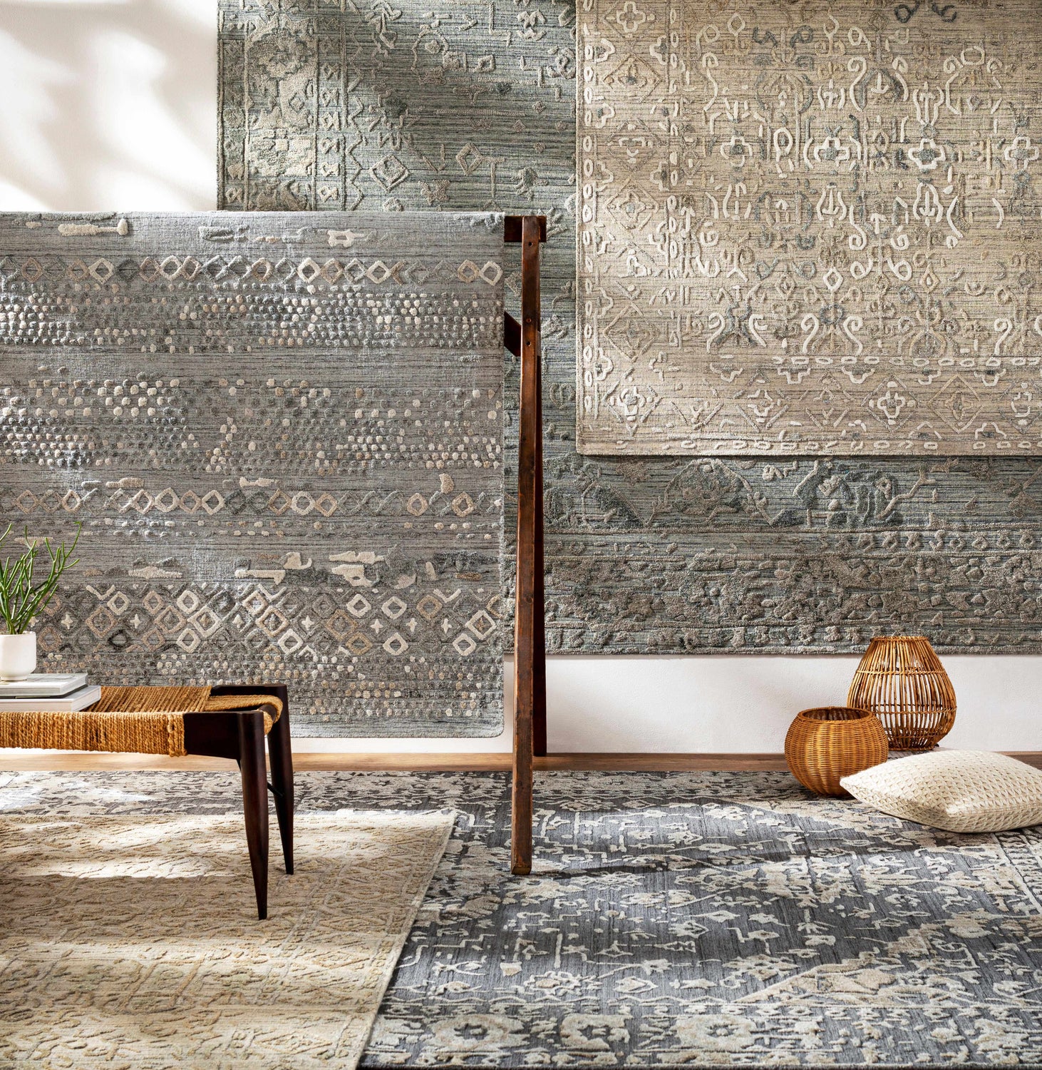 Styled room scene with multiple Macgregor Area Rugs in charcoal, gray, and olive, showcasing their bohemian and farmhouse designs. Styleshot