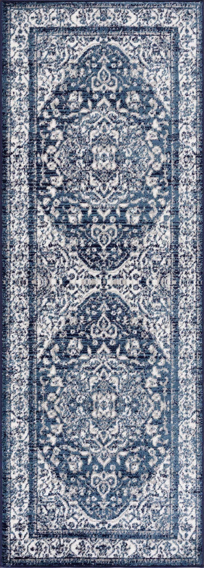 Close-up of the Billy Area Rug; a blue and navy traditional Persian runner rug with an intricate floral pattern. Design-Runner