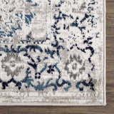 Close up of Duena Area Rug showing blue and gray traditional vintage pattern. Swatch
