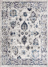 Close-up of the Duena Area Rug: traditional oriental design in blue and light gray, machine woven texture. Design-Rectangle-46