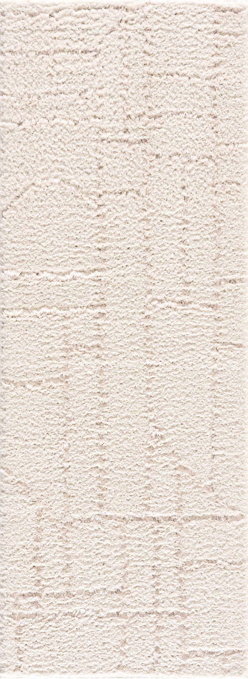 Close-up of the plush, cream-colored Andia Plush Grid Rug, showing its shag texture and subtle geometric grid pattern. Design-Runner
