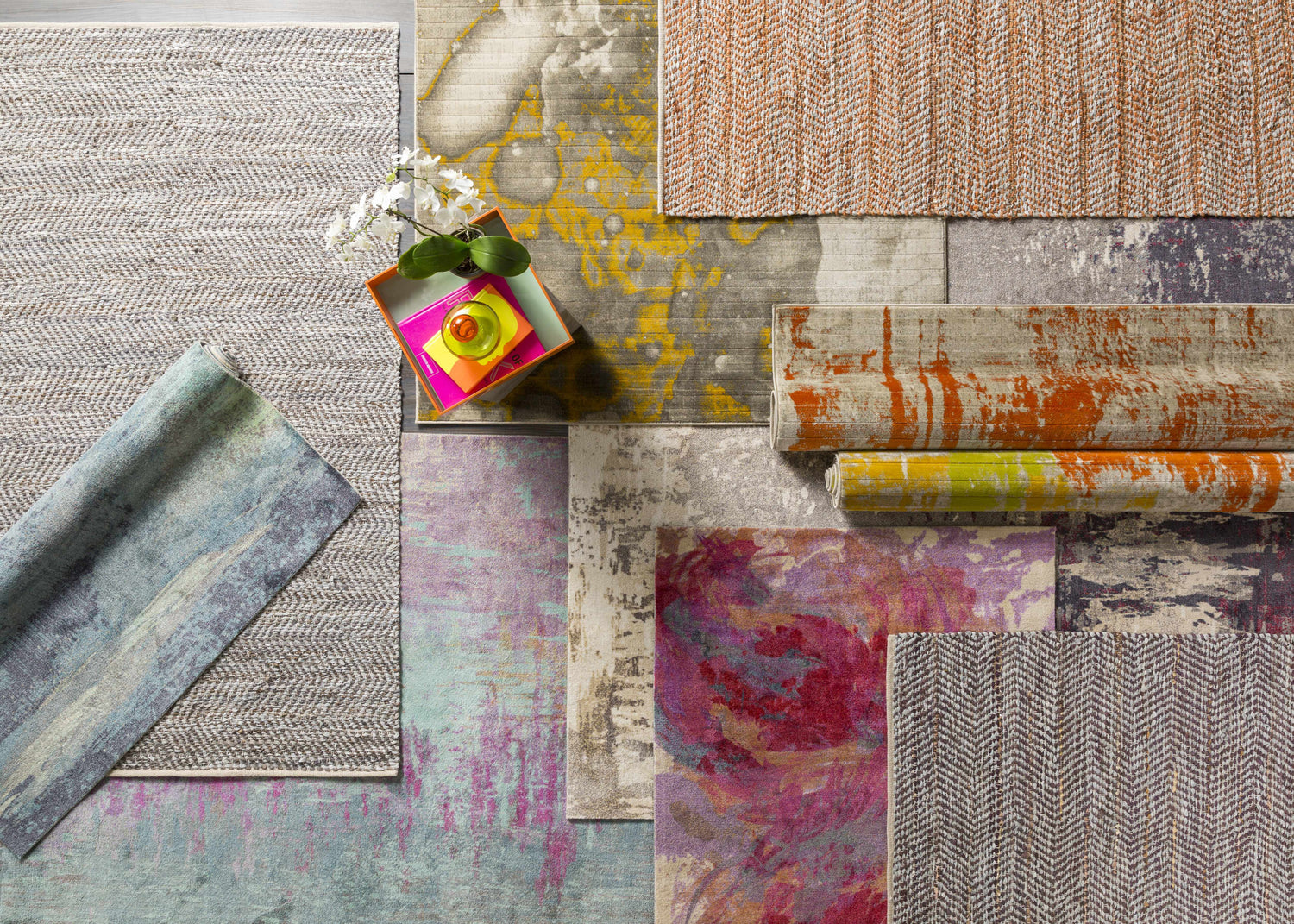 Variety of rug textures and patterns, including the Alvaton Abstract Blue Rug, in blue, gray, and beige tones. Styleshot