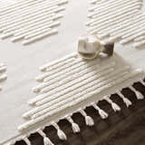 Close-up of the Palimbang Cream 3D Rug showing its geometric design, tassels, and textured, high-pile construction. Styleshot