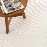 Close-up of the Palimbang Cream 3D Rug showing its geometric design and textured, raised pattern in bone and cream colors. Styleshot