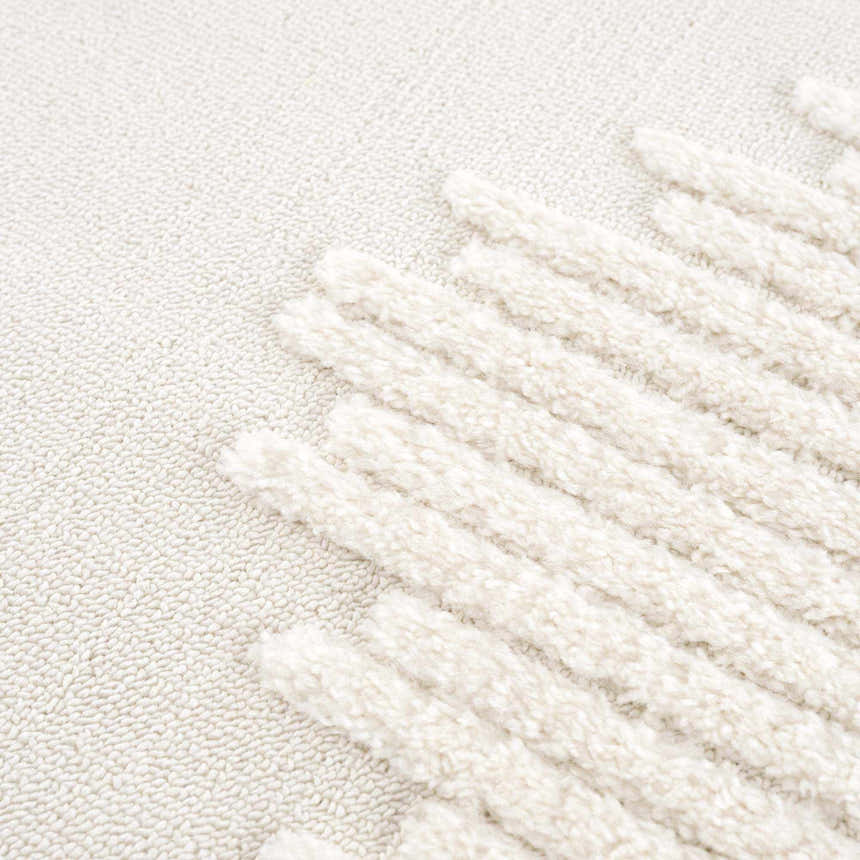 Close-up of the Palimbang Cream 3D Rug showing its bone and cream colors and geometric, textured design. Texture