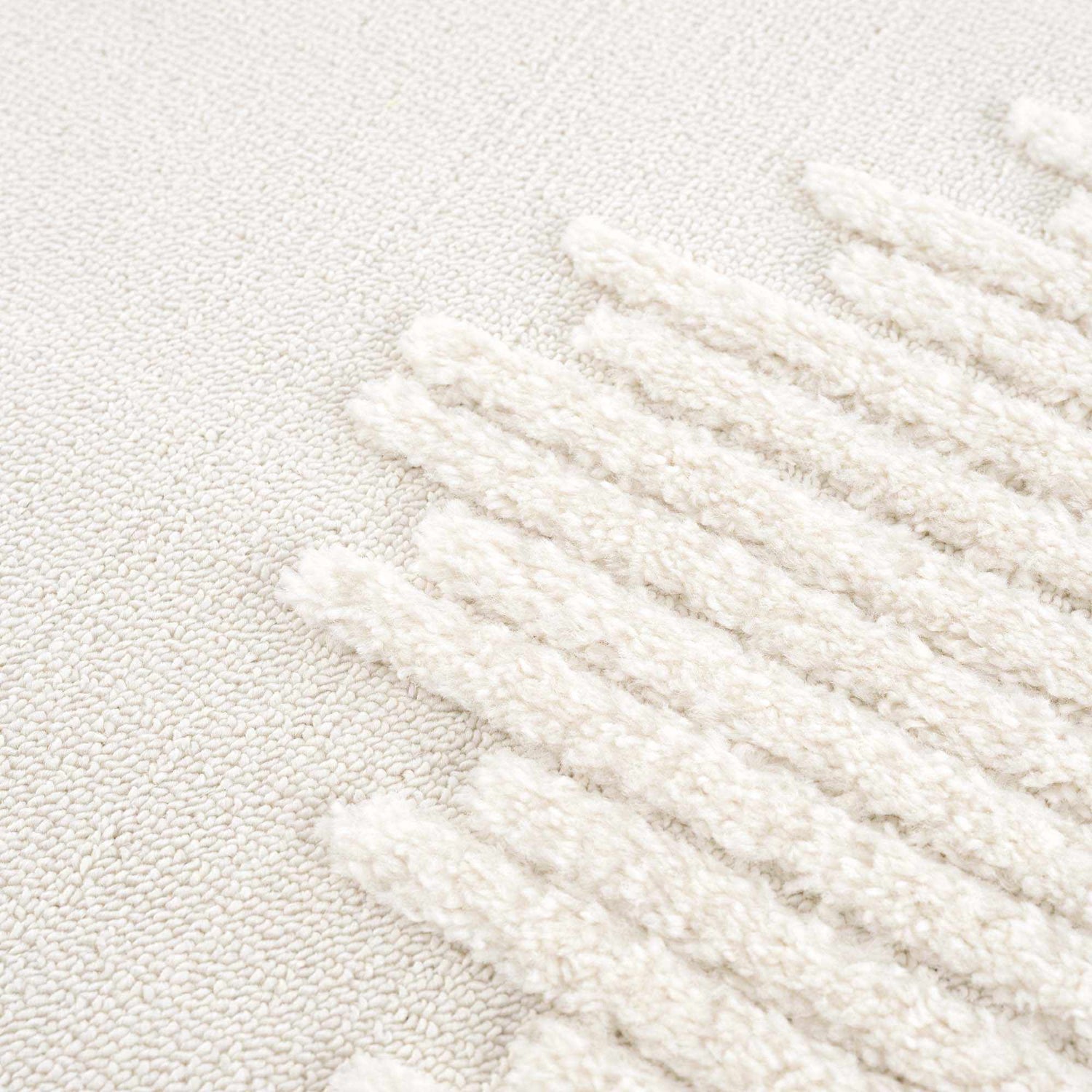 Close-up of the Palimbang Cream 3D Rug showing its bone and cream colors and geometric, textured design. Texture