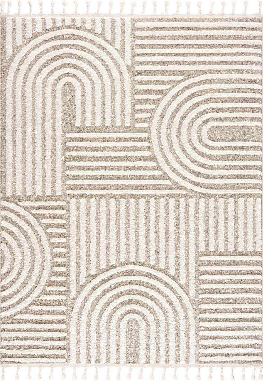 Close-up of the Moise Area Rug, featuring a beige and cream contemporary geometric pattern with tassels. Design-Rectangle-46