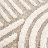 Close-up of the Moise Area Rug showing beige and cream colors with a textured, contemporary striped design. Texture