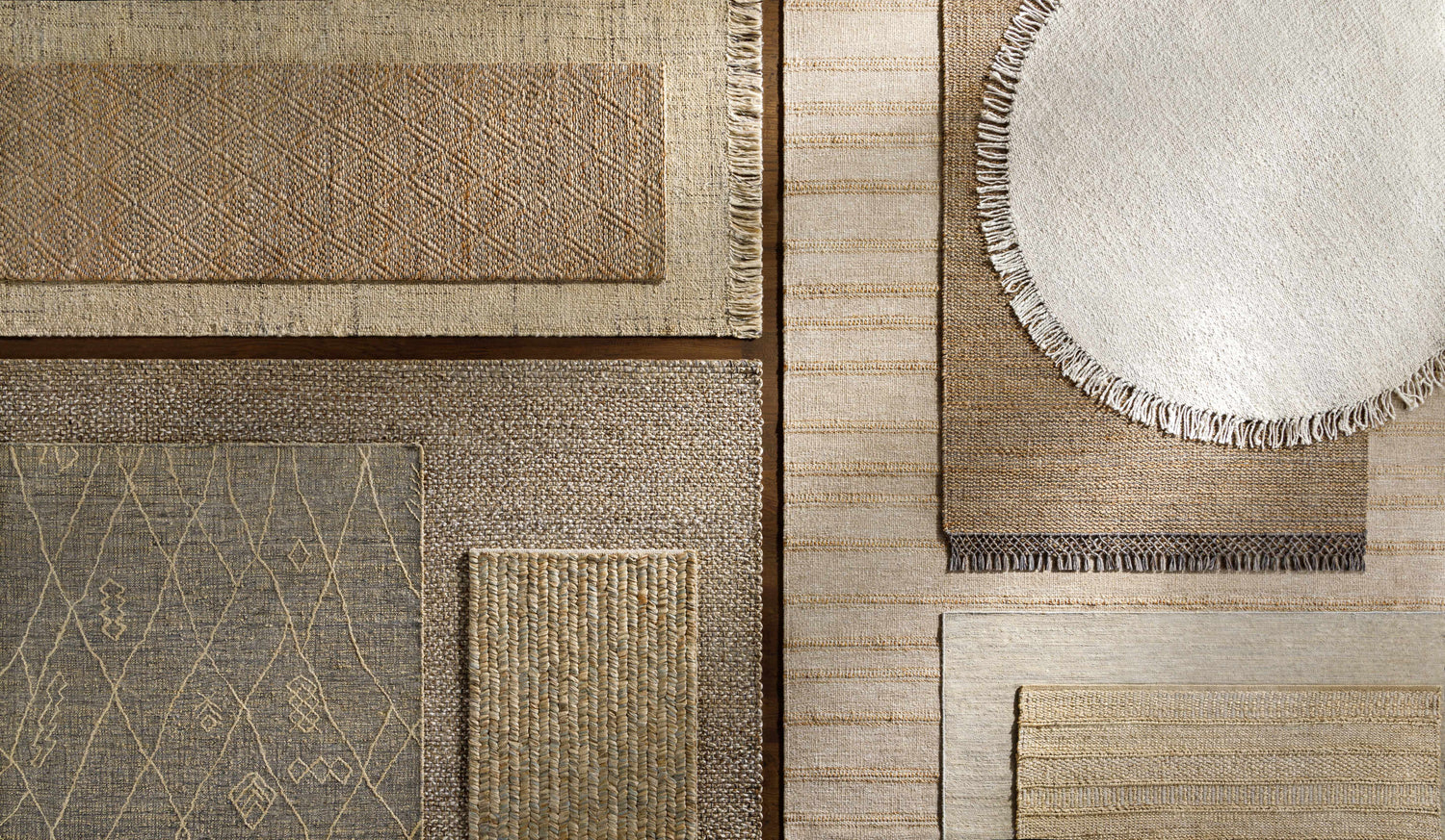 Close-up of Bywong Area Rug - Clearance. Assorted jute rugs in beige, off-white, and diamond patterns. Hand-woven texture. Styleshot