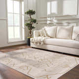 Living room scene with a cream sofa and the Azzan Cream & Gold Area Rug on a dark wood floor. Roomscene-Rectangle