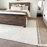 Bedroom scene with a Palimbang Cream 3D Rug, a dark wood bed, white bedding, and a full-length mirror. Neutral tones, cozy vibe. Roomscene-Rectangle