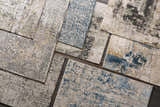 Close-up of several Schaefferstown Area Rugs showcasing charcoal, gray, beige, and blue vintage-inspired patterns. Styleshot