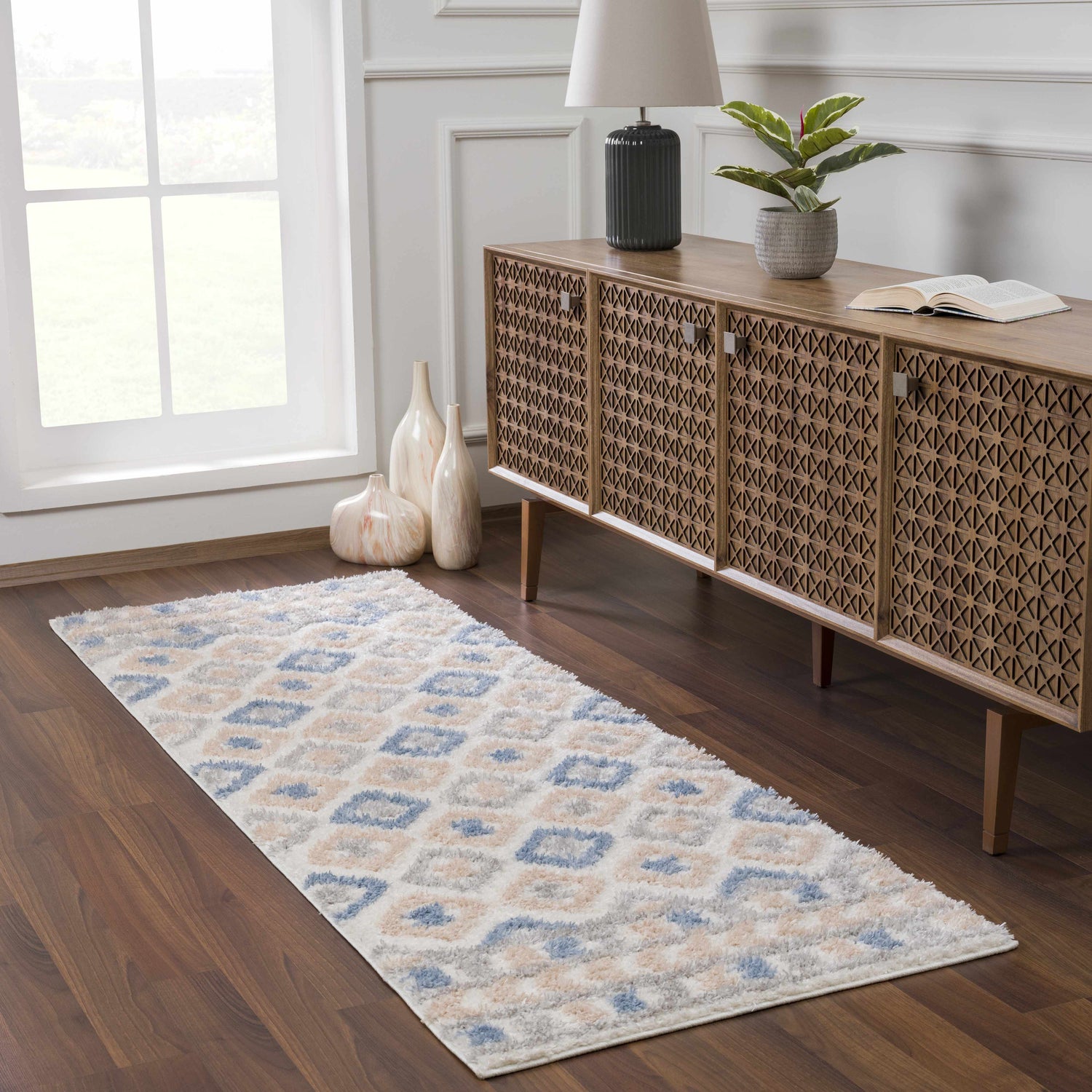 Entryway with Eivin Pink & Blue Area Rug, wood console table, and marble vases. Bohemian style runner rug. Roomscene-Runner