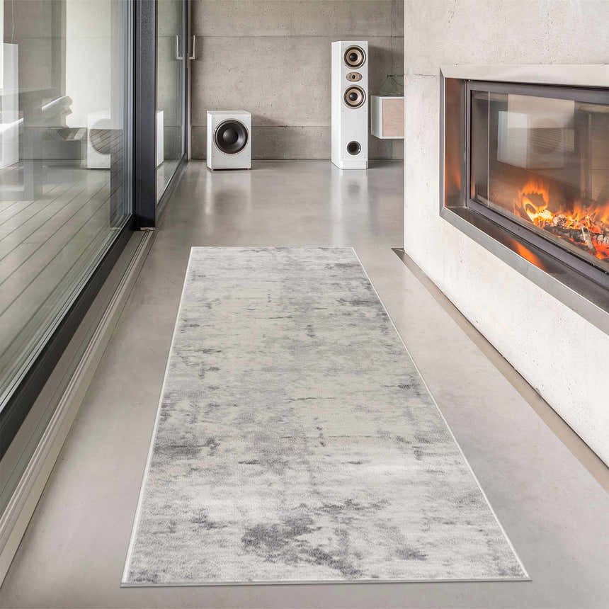 Modern living room with fireplace and Tigrima Ivory 2319 Area Rug. Gray and ivory runner rug on concrete floor. Roomscene-Runner