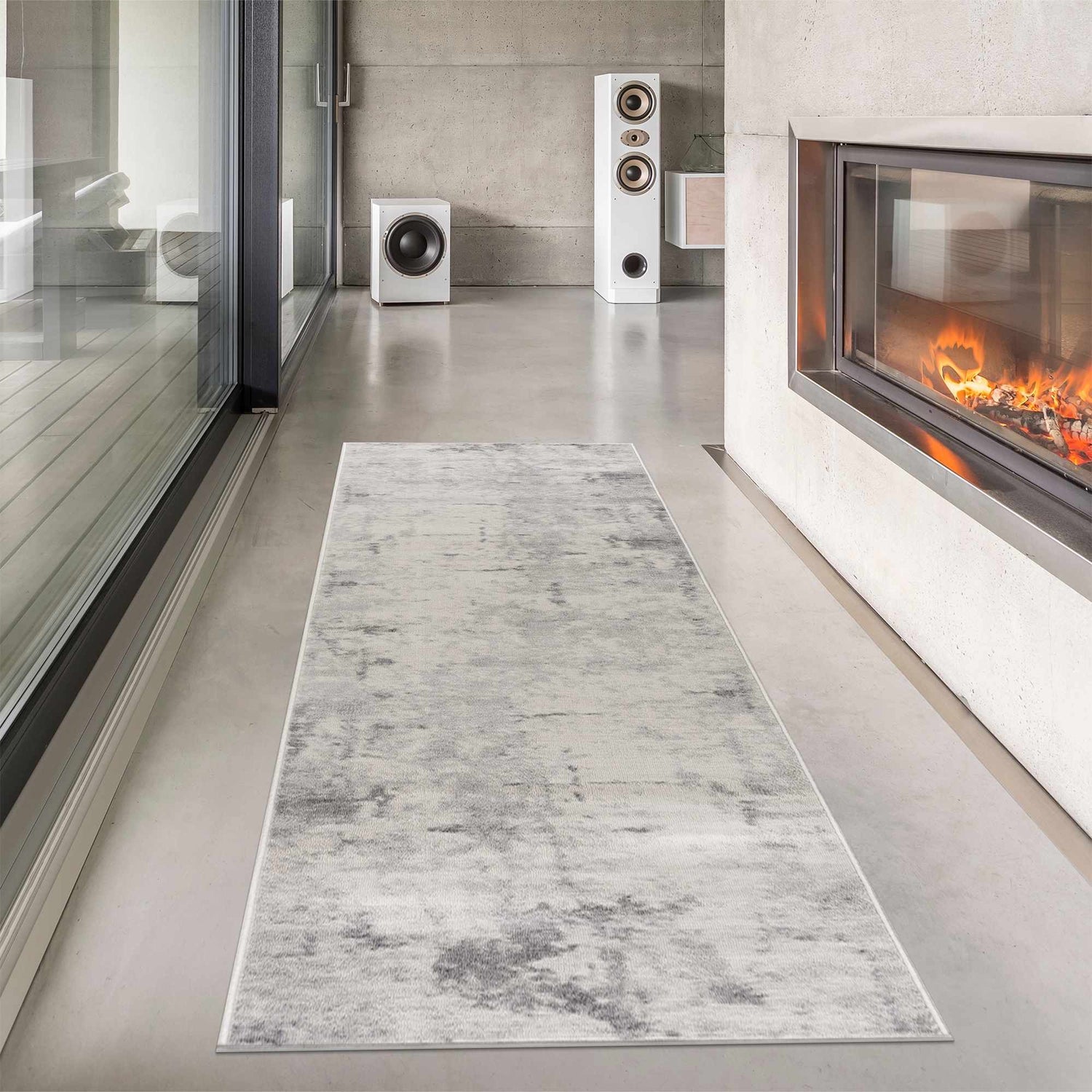 Modern living room with fireplace and Tigrima Ivory 2319 Area Rug. Gray and ivory runner rug on concrete floor. Roomscene-Runner