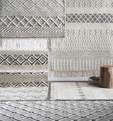 Close-up of hand woven Cobourg Area Carpet in black and cream wool. Geometric patterns and fringe detail. Styleshot