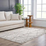 Living room scene with a bone-colored sofa and the Nyla Bone Indoor & Outdoor Rug with a geometric pattern. Roomscene-Rectangle