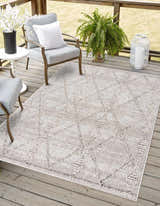 Outdoor patio scene with gray chairs and Nyla Bone Indoor & Outdoor Rug. Contemporary design. Roomscene-Rectangle