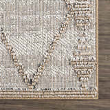 Close-up of the textured Nyla Bone & Tan Performance Rug showing woven details and neutral colors on a wood floor. Swatch