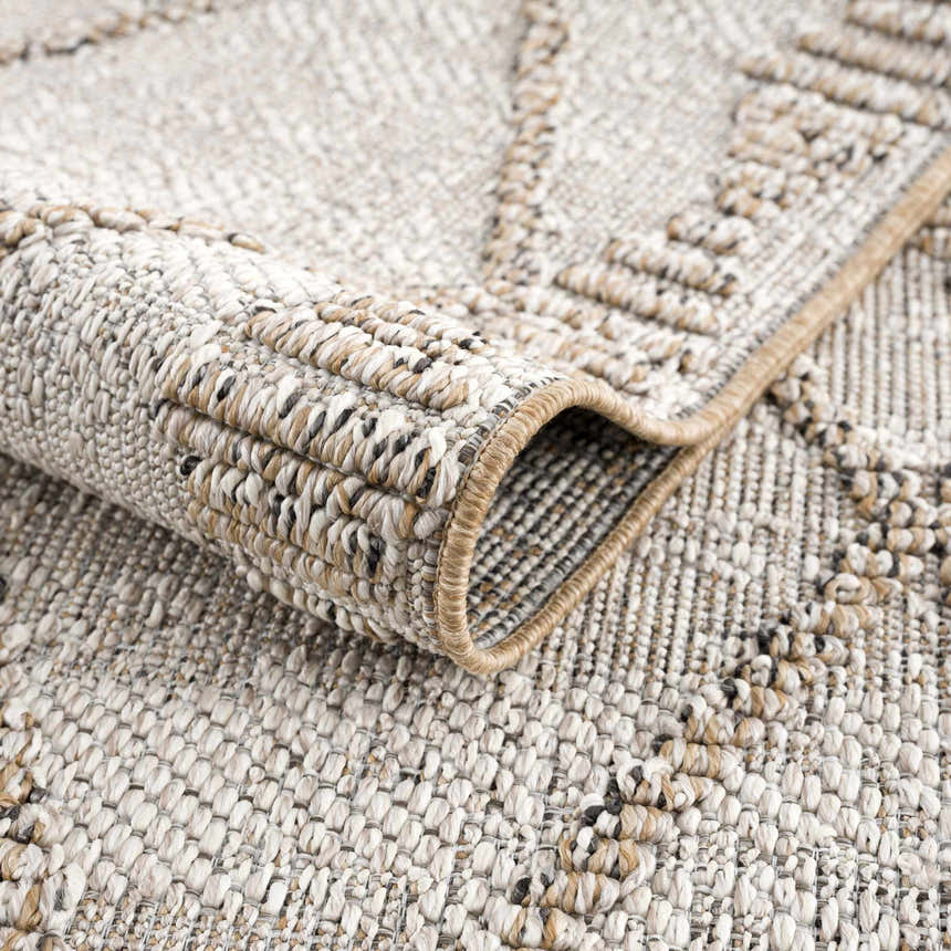 Close-up of the Nyla Bone & Tan Textured Performance Rug showing its woven texture and geometric pattern. Fold