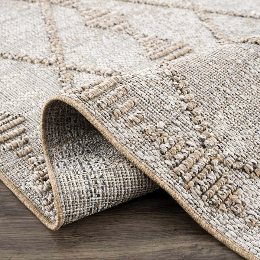 Close-up of Nyla Bone & Tan Textured Performance Rug showing woven texture and geometric pattern. Farmhouse style. Fold