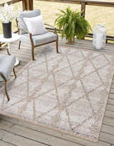 Outdoor patio scene with Nyla Bone & Tan Textured Performance Rug, gray chairs, white accents, and wood decking. Roomscene-Rectangle