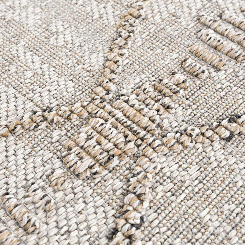 Close-up of the textured Nyla Bone & Tan Performance Rug, showing woven bone, tan, and gray yarns. Texture