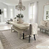 Light and airy dining room with a Sulak Cream Area Rug, white table, and neutral decor. Roomscene-Rectangle