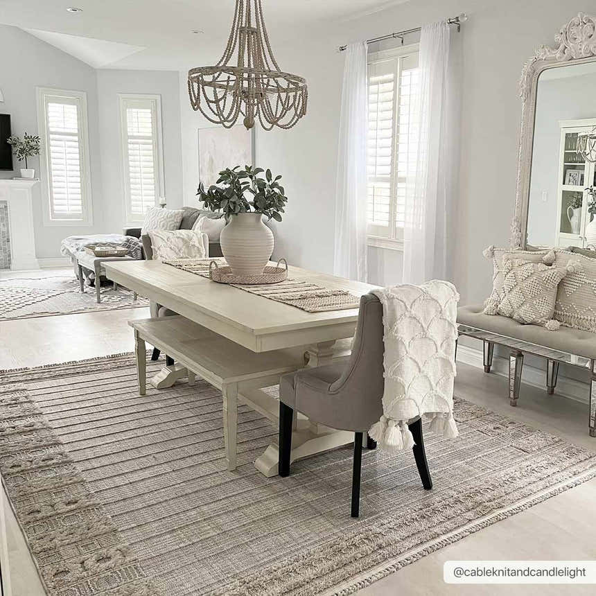 Light and airy dining room with a Sulak Cream Area Rug, white table, and neutral decor. Roomscene-Rectangle