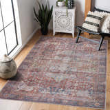 Entryway with a Rust Elki Vintage Medallion Washable Area Rug, wood floors, black chair, and white cabinet. Roomscene-Rectangle