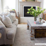 Farmhouse living room with a Tinampo Area Rug, linen sofa, white coffee table, and brick fireplace. Roomscene-Rectangle
