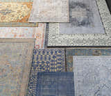 Overhead view of assorted Toquerville Premium Rugs in aqua, charcoal, oatmeal, and wheat colors showing various patterns. Styleshot