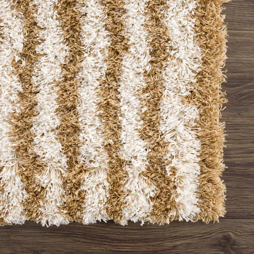 Close-up of a Calup Shag Area Rug. Bone and dark brown stripes create a soft, textured, geometric pattern. Swatch