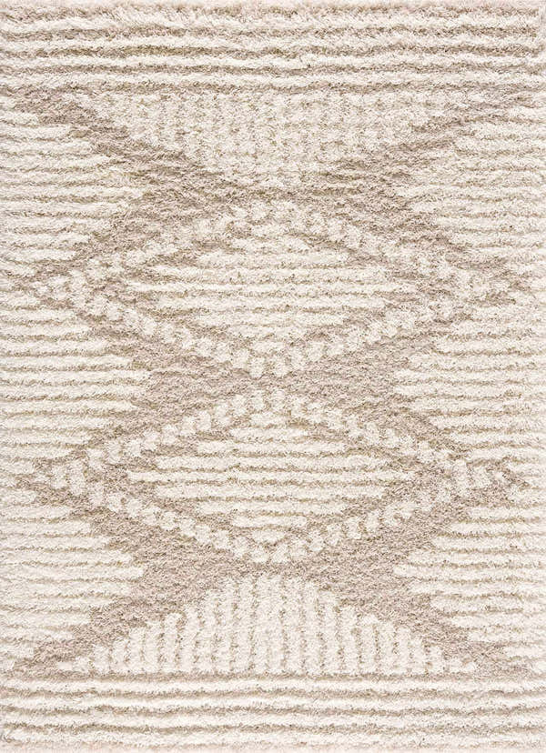 Close-up of the Igor Shag Area Rug featuring a geometric pattern in gray, light peach, mocha, and nutmeg hues. Design-Rectangle-5373