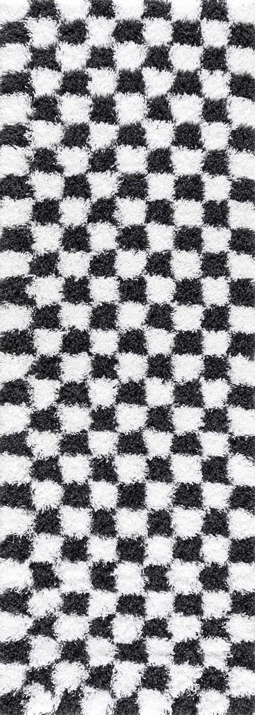 Close-up of the Atira Black & White Checkered Area Rug, showing the geometric checkerboard pattern and plush texture. Design-Runner-2773