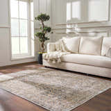 Living room scene with a beige sofa and the Orsin Washable Area Rug in a traditional pattern on a dark wood floor. Roomscene-Rectangle