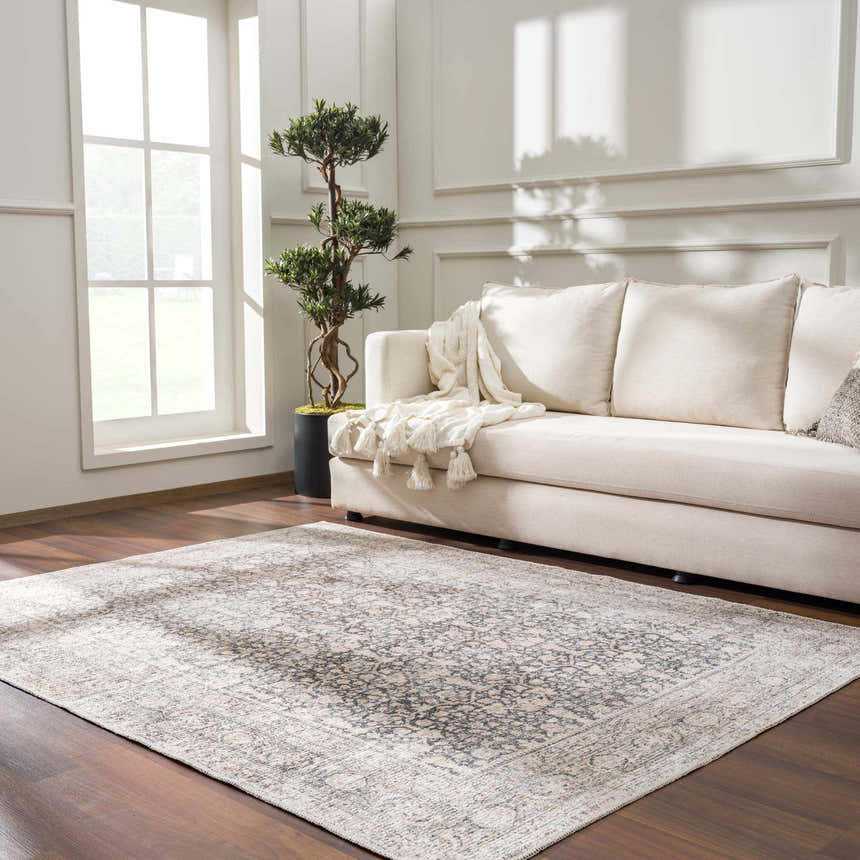 Living room with cream sofa and gray Odele Washable Area Rug. Farmhouse style, traditional pattern. Roomscene-Rectangle