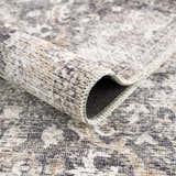 Close-up of the Mohan Washable Area Rug showing its farmhouse style, traditional pattern, and chenille polyester texture. Fold