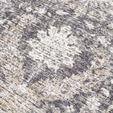 Close-up of the Mohan Washable Area Rug showing a traditional floral pattern in gray, beige, and white chenille polyester. Texture