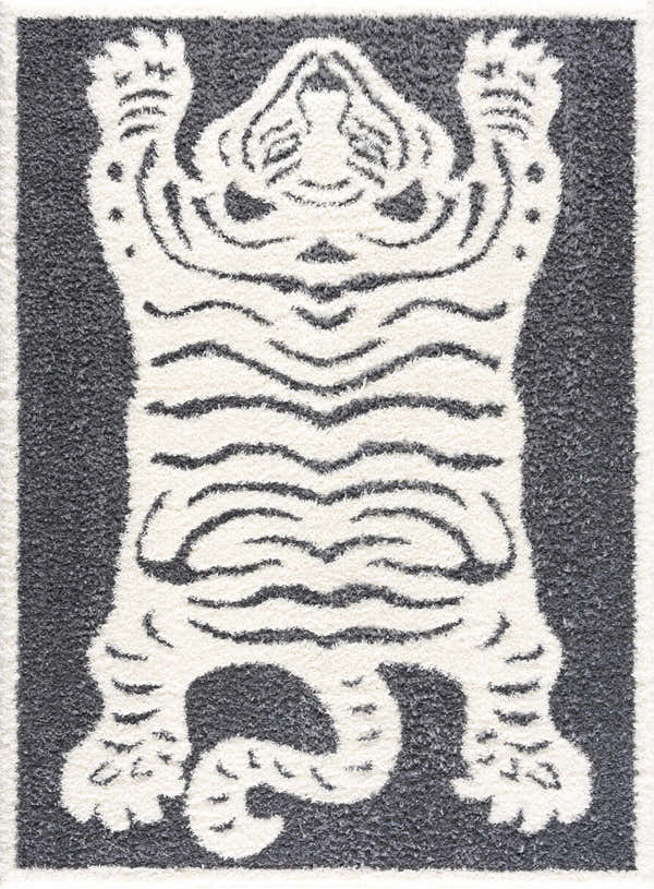 Close-up of Zane Charcoal Tibetan Tiger Plush Rug, featuring a cream tiger design on a slate blue background. Design-Rectangle-46