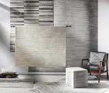 Scandinavian-style room with a Wauzeka Premium Area Rug, leather chair, and ottoman in brown, cream, and gray tones. Styleshot