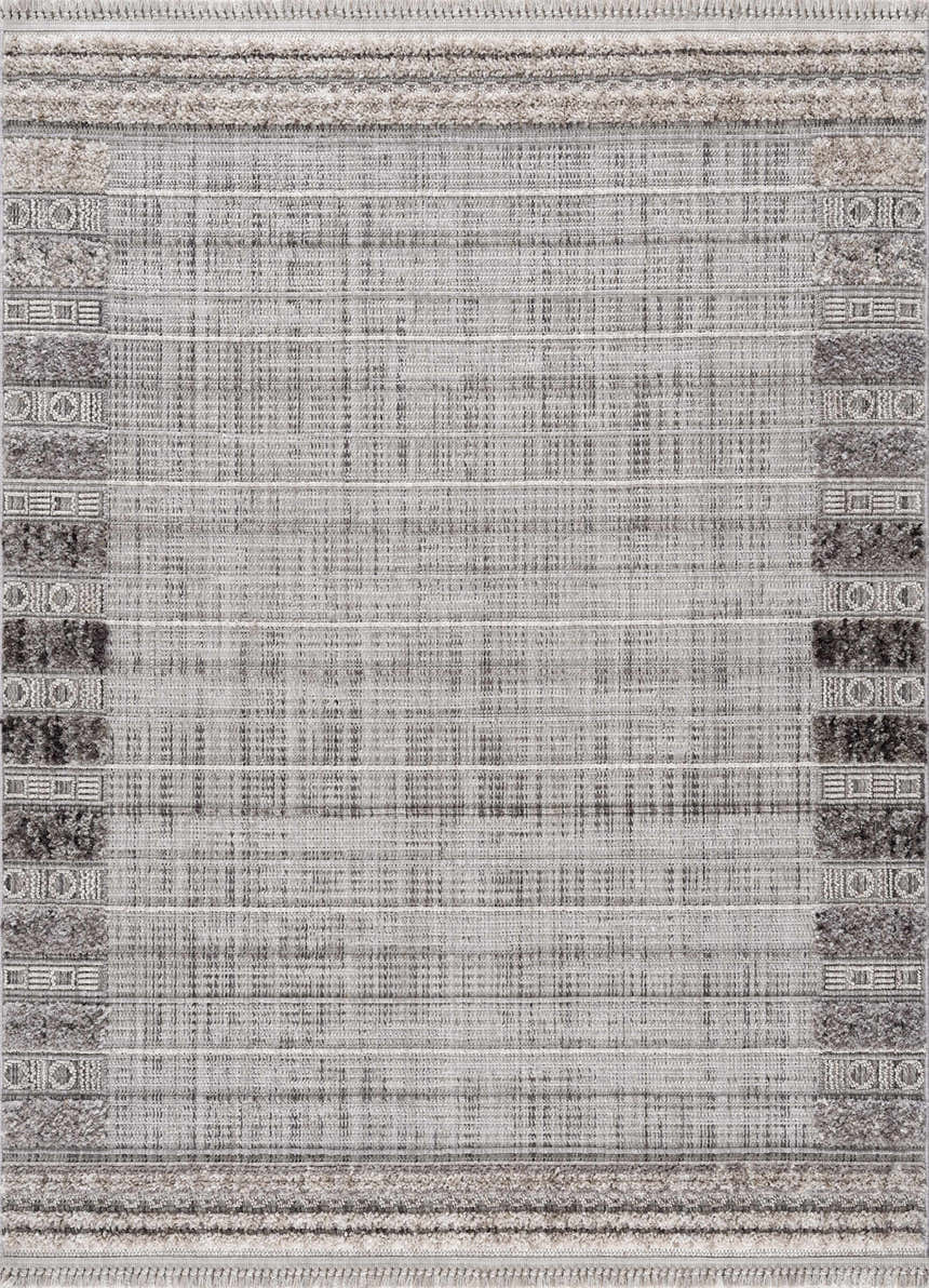 Close-up of the Naivasha Elegant High/Low Area Rug featuring charcoal, cream, and gray tones with a textured, geometric pattern. Design-Rectangle-537