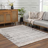 Living room scene with gray sofa and Naivasha Elegant rug in charcoal, cream, and beige on wood floor. Roomscene-Rectangle