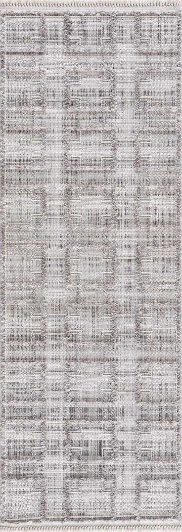 Close-up of the Knocklyon High-Low Rustic Rug. Features a geometric pattern in charcoal, cream, and gray tones. Design-Runner-2773