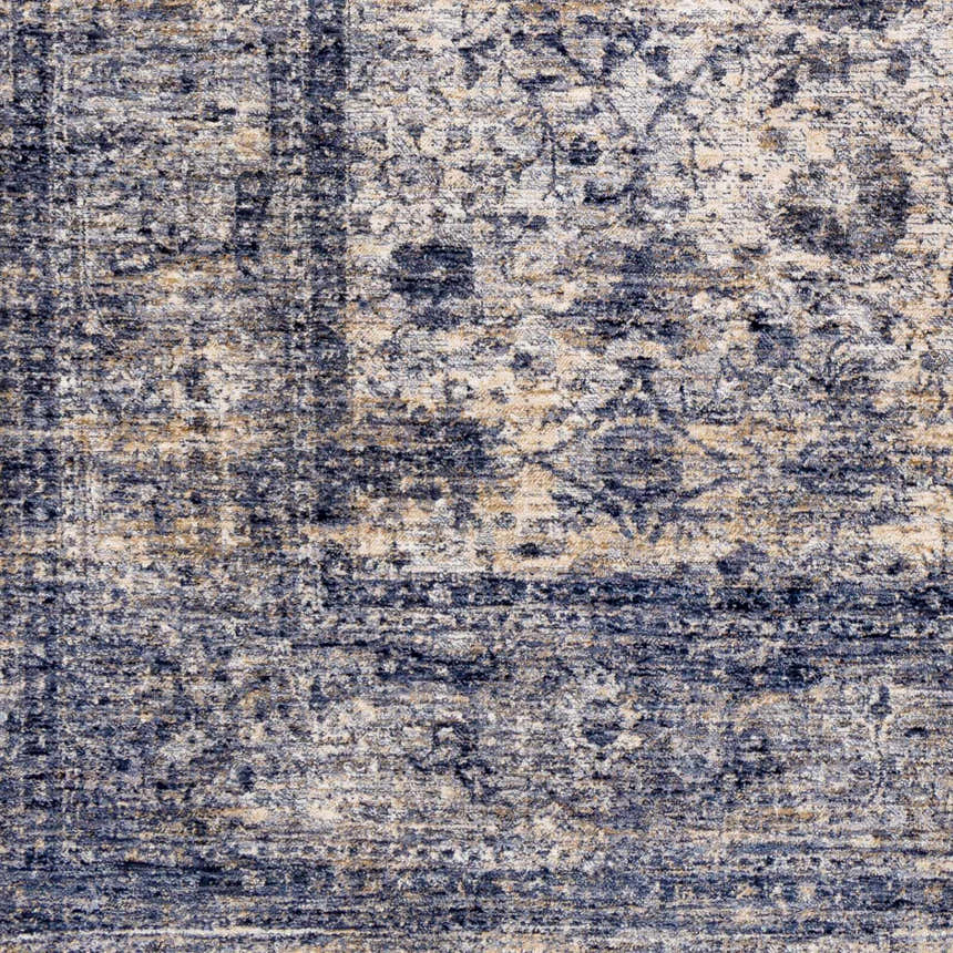 Close-up of Accokeek Luxe Area Rug showing its traditional pattern, denim, light beige, and navy colors, and soft texture. Swatch